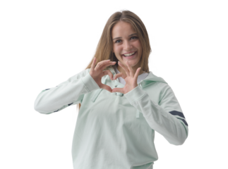 Happy young woman forming a heart shape with her hands
