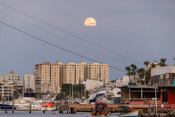 view of the moonrise in the urca neighborhood in rio de janeiro.