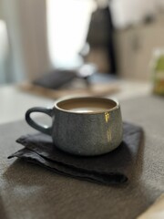 cup of coffee on wooden table