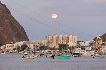 view of the moonrise in the urca neighborhood in rio de janeiro.