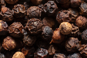 Close up of black peppercorns. 