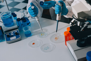 Collaboration, tablet or science with people in lab together for research or development. Innovation, tech and microscope with scientist team in clinical trial for planning or medical investigation