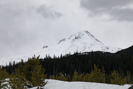 Snow covered Mt Hood on a dark winter day, bleak winter landscape background, horizontal aspect