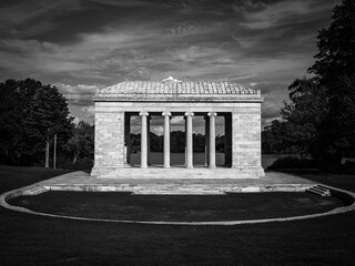 Roger Williams Park in Providence, Rhode Island, featuring the iconic Temple to Music beside Cunliff Lake, a classical marble landmark architecture, a retro-style black and white photo