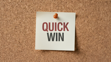 Quick Win concept pinned on corkboard, ideal for business success, goals, and achievement