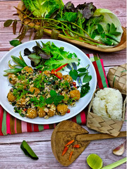 Larb Moo, a delicious local dish from the northeastern region of Thailand. Aroma from essential oils in spices Delicious taste from the spicy flavors typical of oriental food. with sidedish vegetable.