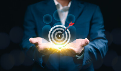 Businessman Holding Digital Target Representing Teamwork, Goal Setting and Target Achievement...