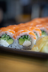 sushi with salmon and cheese.