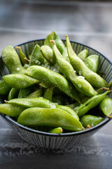 appetizers green edamame beans on the table.