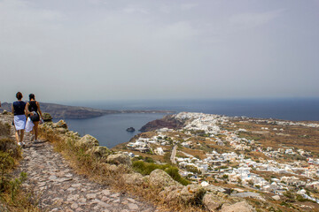 tourist  and view of Oia at Santorini island, Greece