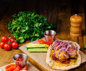 Deliciously prepared grilled chicken served with fresh vegetables and herbs