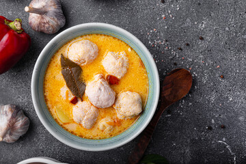 Soup with meatballs, potatoes and cheese. Meatballs in thick vegetable soup Albondigas. Mexican and Spanish, European and Russian cuisine. Grey background