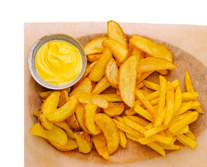 Delicious potato wedges and golden fries served with creamy dip