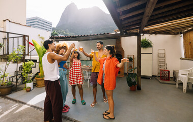 Friends enjoying a gathering on a scenic rooftop during a sunny day