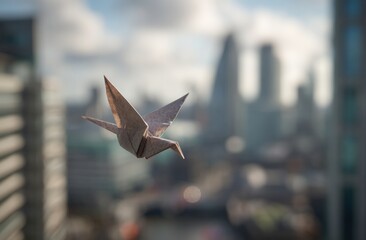 Origami crane soaring above a cityscape