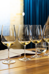 White Wine Tasting Set with Multiple Bottles and Glasses.
