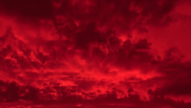 Dramatic red sky with ominous clouds creating a powerful and intense atmospheric phenomenon