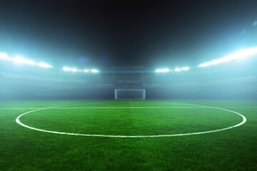 Obraz premium Illuminated football stadium at night with green field and empty stands, ready for an exciting match under bright floodlights. Football tournament and football championship. Blurred background
