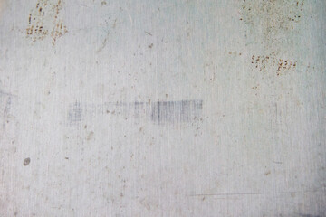 Close-up of weathered, textured surface with faint wall