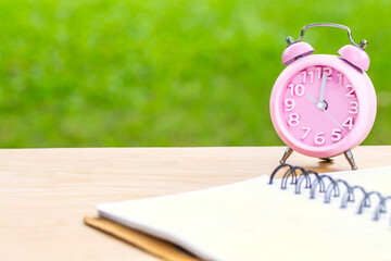alarm clock and notebook