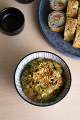 Green wakame salad with seaweeds and sesame seeds.