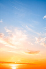 Beautiful , luxury soft gradient orange gold clouds and sunlight on the blue sky perfect for the background, take in evening,Twilight, Large size, high definition landscape photo,Vertical