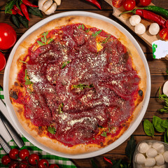 Pizza carpaccio with arugula parmesan cheese. Carpaccio on pizza