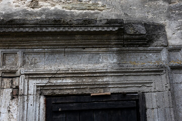 An ancient stone doorway with intricate carvings and weathered textures, showcasing historical...