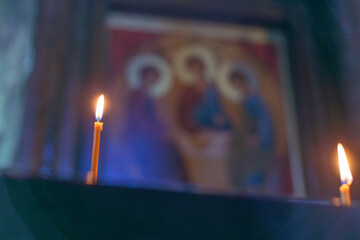 burning candles in an orthodox church
