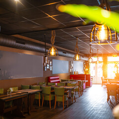 Sunny empty restaurant interior with no people tables sun restaurant