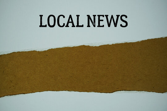 Local News text on paper craft with white paper torn ripped of horizontal