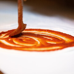 Classic homemade tomato sauce with basil for pasta and pizza horeca kitchen
