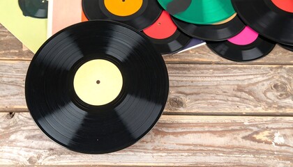 Vinyl records on rustic wooden table