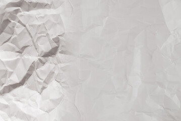 Crumpled white paper background.