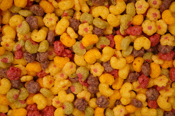 Sweet crunchy cornflakes as a background. Top view.
