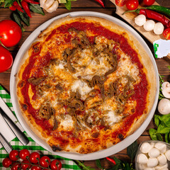 Pizza with shoarma, mozzarella and tomato sauce. Pizza on a wooden table