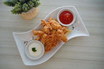 Crispy Fried Chicken with Chili Sauce on Minimal Table Setting