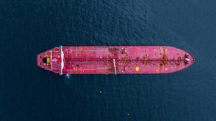 Aerial view crude oil tanker ship at sea, Red crude oil tanker ship top view, Logistic and maritime...