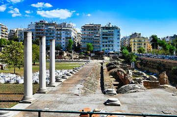 Ancient Roman forum in Thessaloniki with ruins and Modern Urban Backdrop