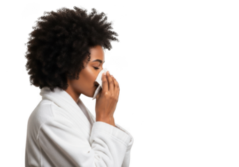Person with afro hair using a tissue to wipe their nose while wearing a white lab coat transparent background