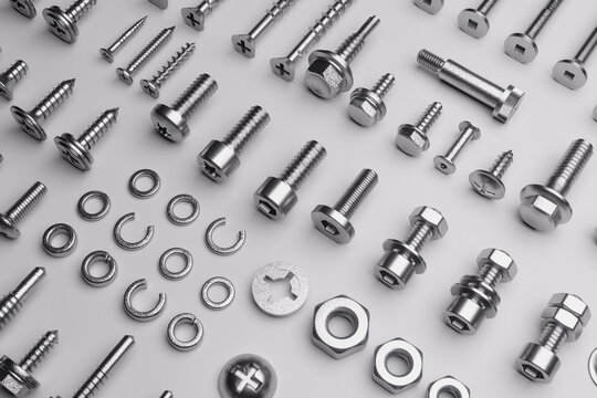 Set of screws, bolts, nuts, and washers neatly arranged on a white background.