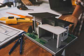 Construction and structure concept of engineer working drawing on blueprint meeting for project...