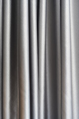 Elegant silver curtain draped downward