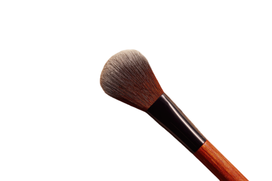 Close-up of a makeup brush, light-brown/tan handle, black ferrule, fluffy light-gray/brown tip