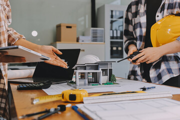 Construction and structure concept of engineer working drawing on blueprint meeting for project...