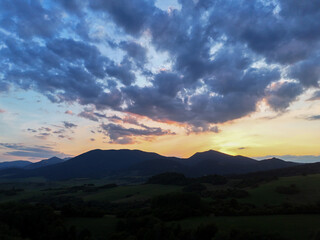 Sunset view of mountain peaks near Dolny Kubin in the Orava region of Slovakia. Warm light over scenic landscape in the Zilina region. Perfect for nature, travel and cinematic visuals.