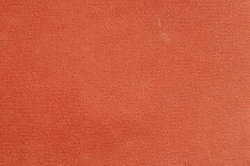 Soft dirty coral fabric shaggy close up as background