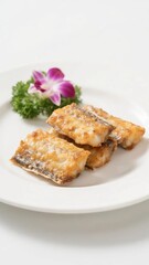 Fried fish fillet with flower garnish