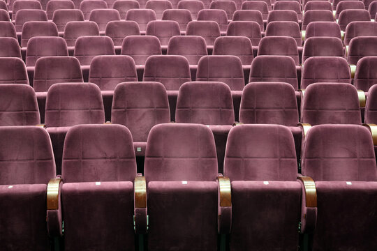 Purple seats in cinema theater opera concert hall 