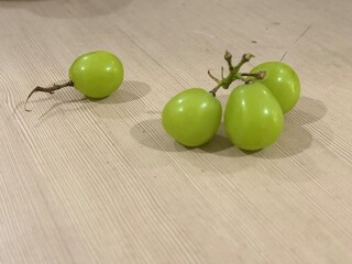 green apples on a wooden table